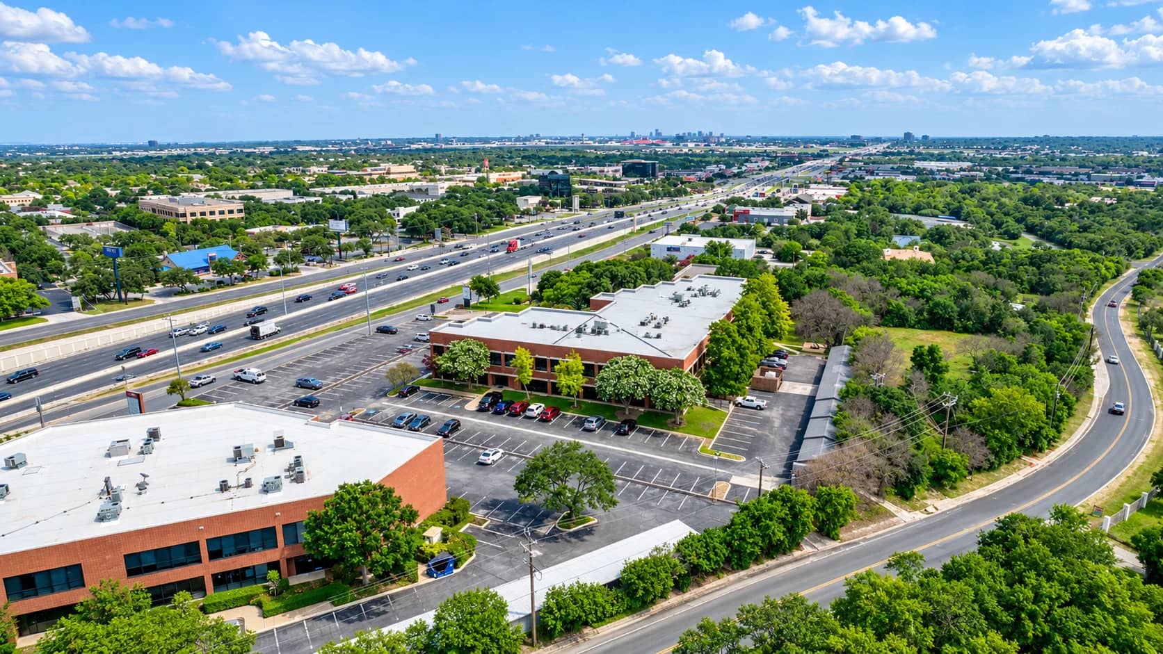 Aerial view of Tru Medical Office Park on San Pedro Avenue with the San Antonio skyline beyond