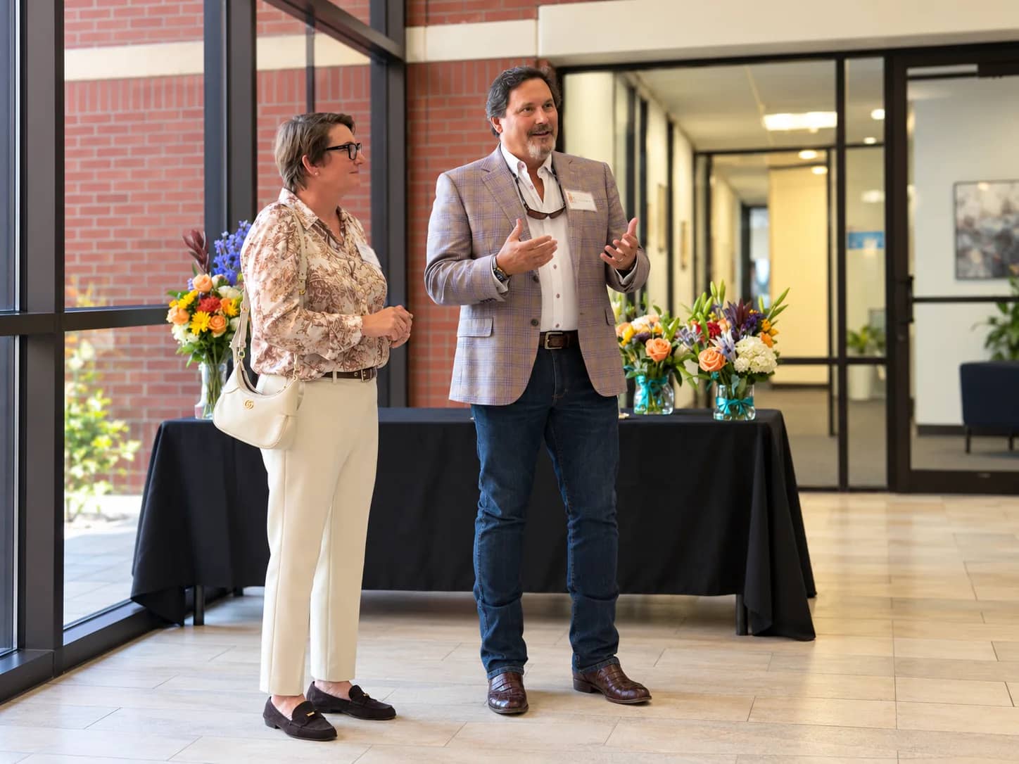 Owners Rick and Amanda speaking in the lobby at the Tru Medical Office Park unveiling